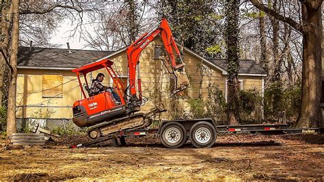 loading mini ex on trailer